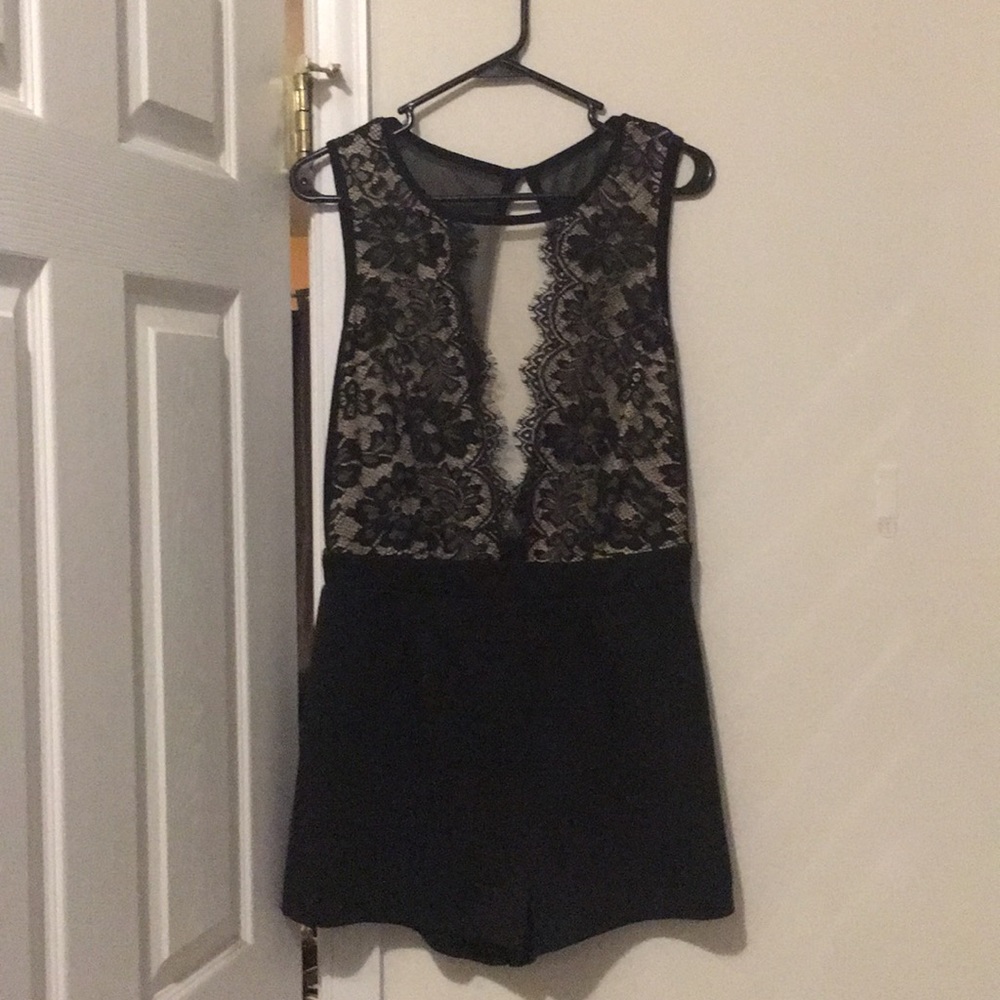 Black romper, deep plunging front